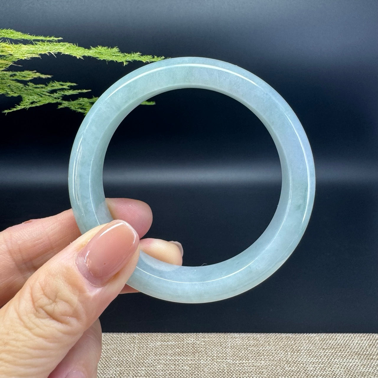 The bangle shape of the half round.The bangle color is icy green.