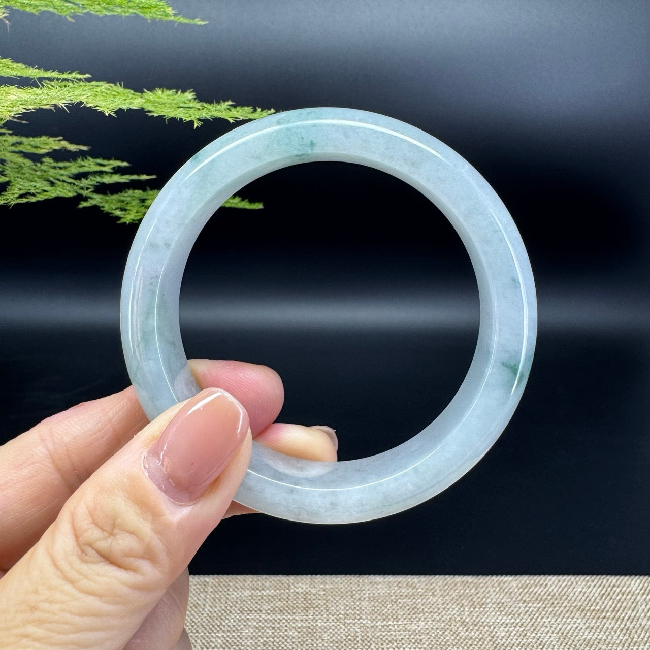 The bangle shape of the half round.The bangle color is icy green.