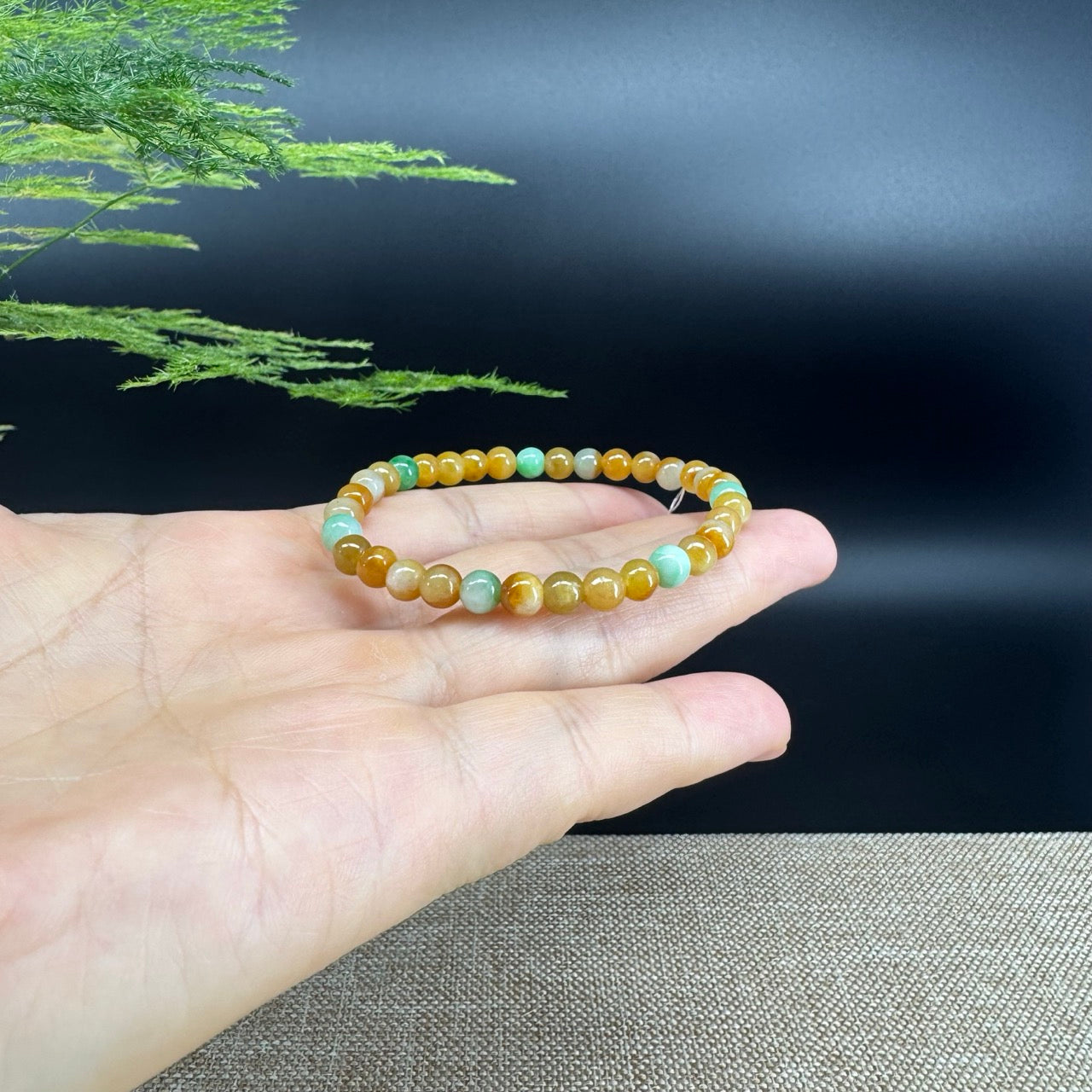 The beads shape of the round.The beads colors are yellow green.