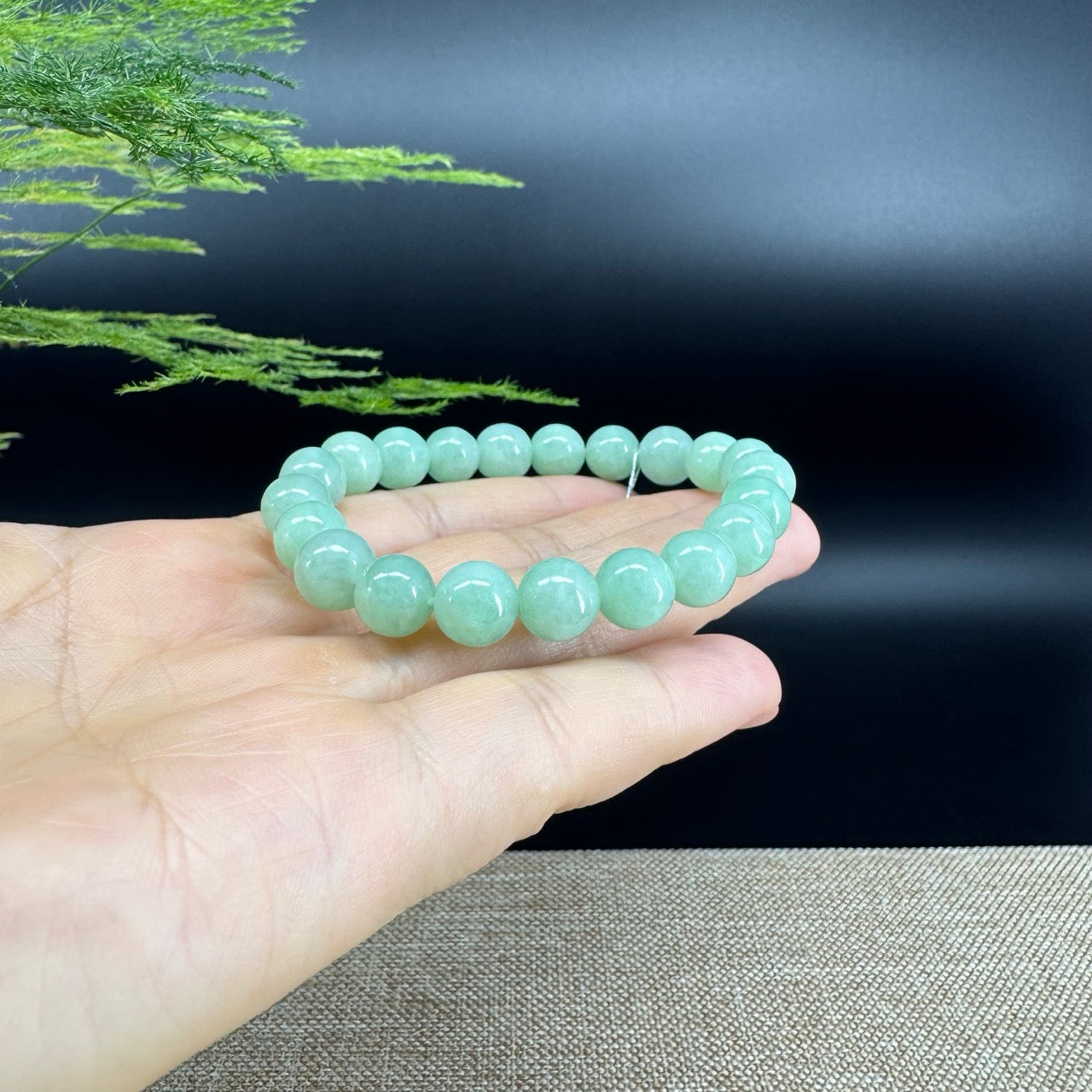 The beads shape of the round.The beads color is apple green.