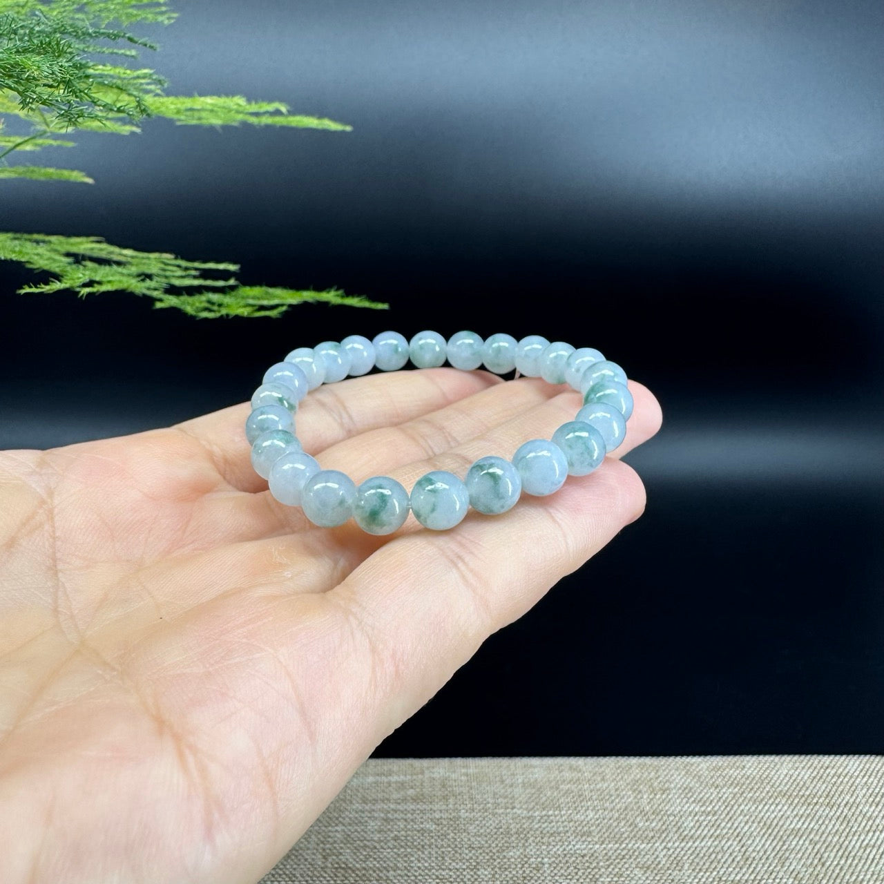 The beads shape of the round.The beads colors are icy blue green.