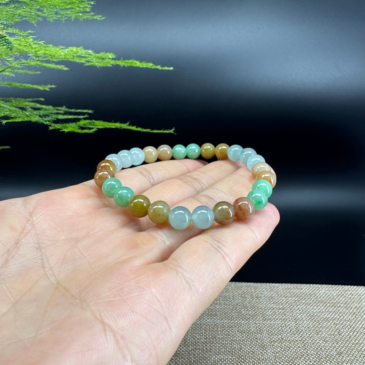 The beads shape of the round.The beads colors are lavender yellow green.