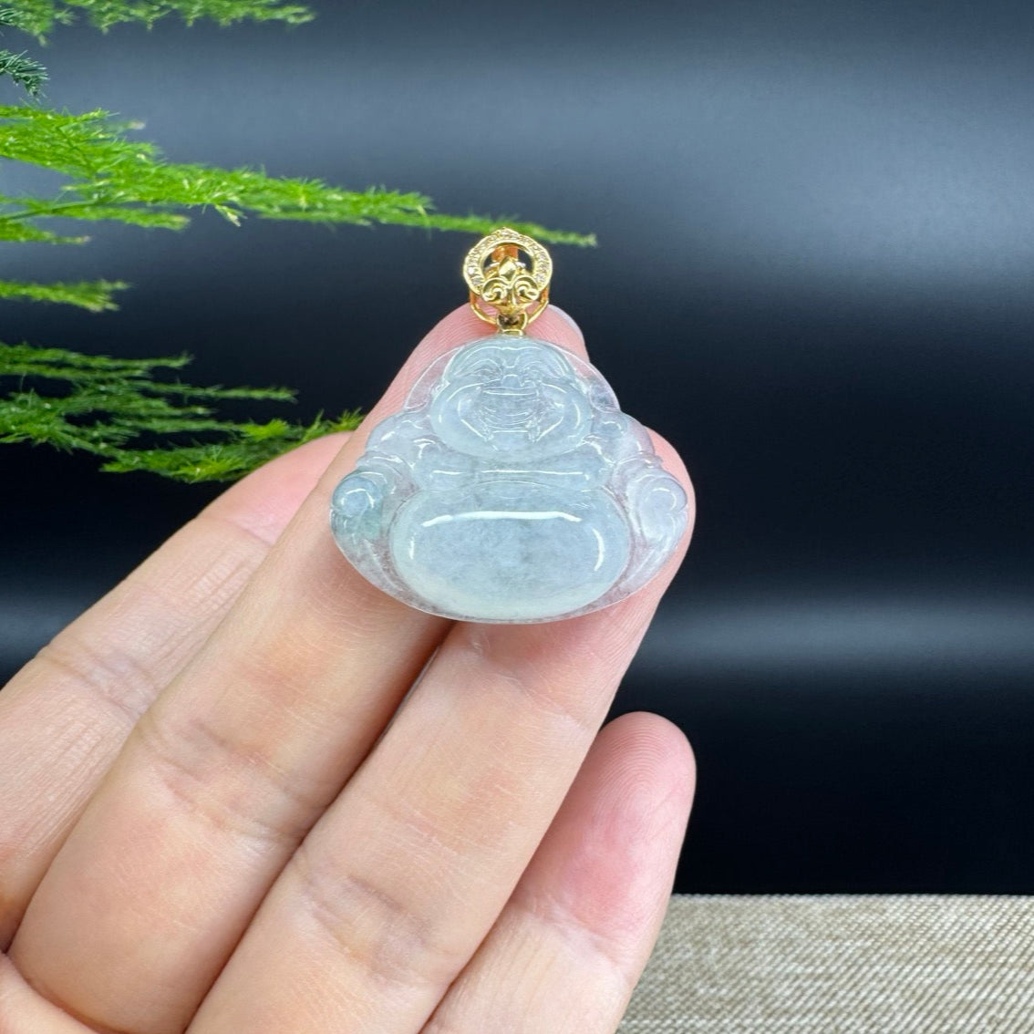The pendant shape of the buddha.The pendant color is icy.