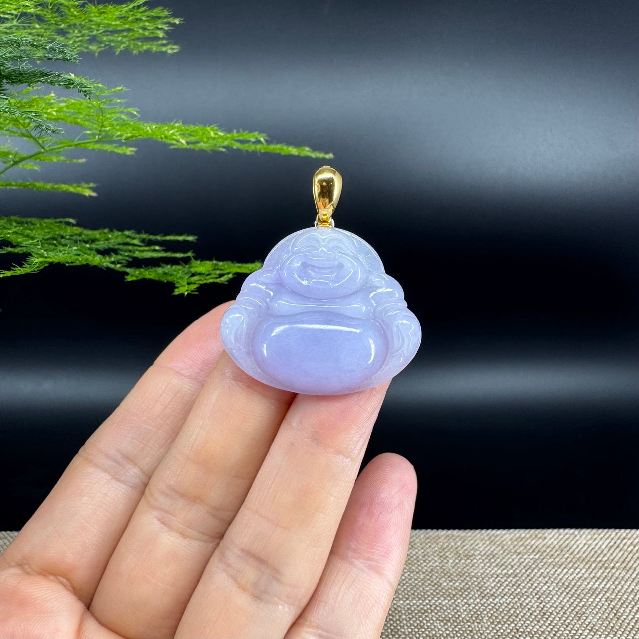 The pendant shape of the buddha.The pendant color is lavender.