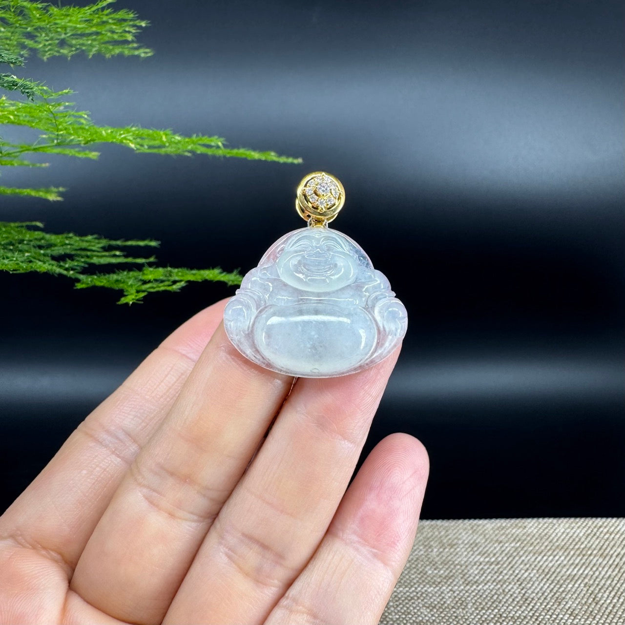 The pendant shape of the buddha.The pendant color is icy.