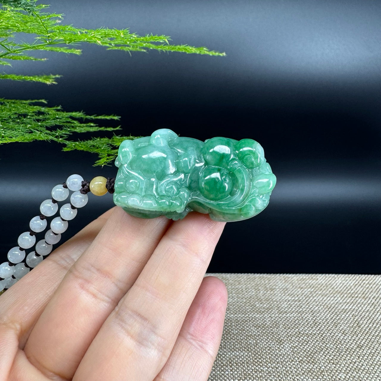 The pendant shape of the pixiu.The pendant color is green.