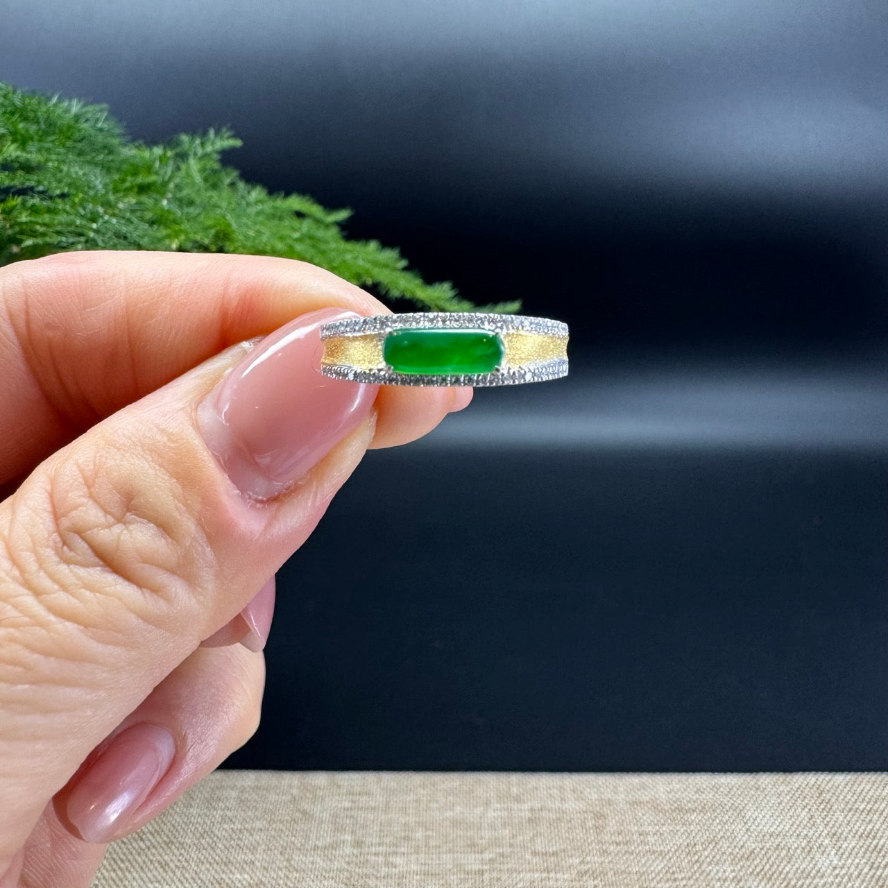 The shape of the ring is rectangle.The ring color is imperial green.