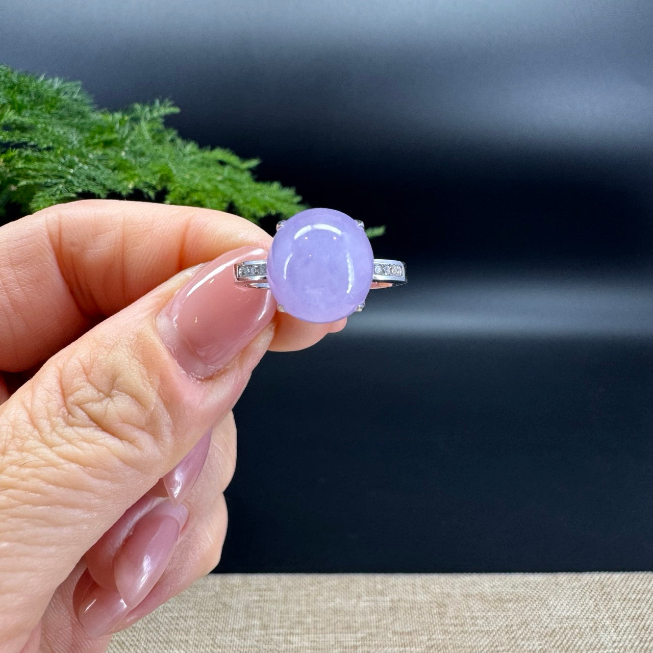 The shape of the ring is round .The ring color is lavender.