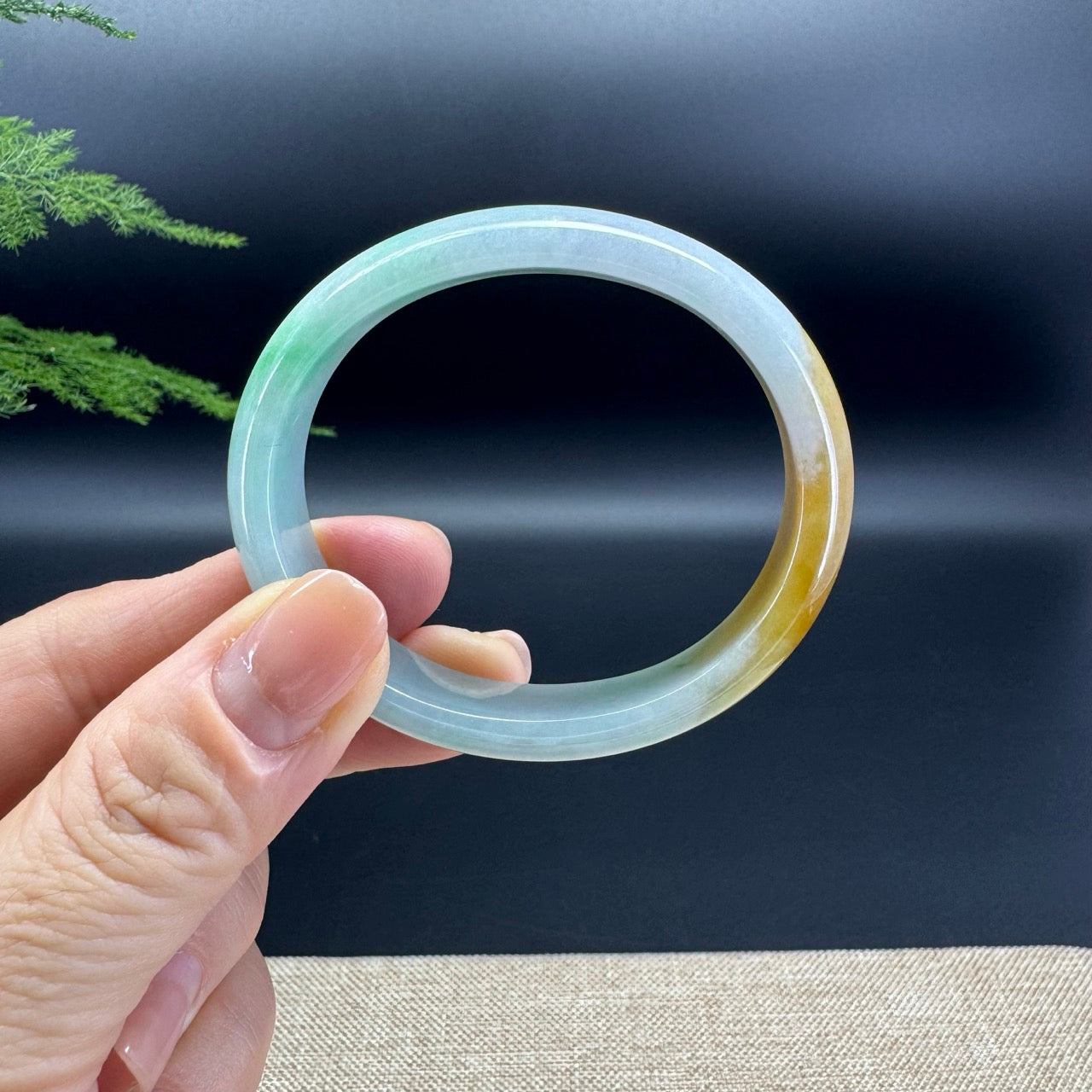 The bangle shape of the oval.The bangle colors are lavender green and yellow.