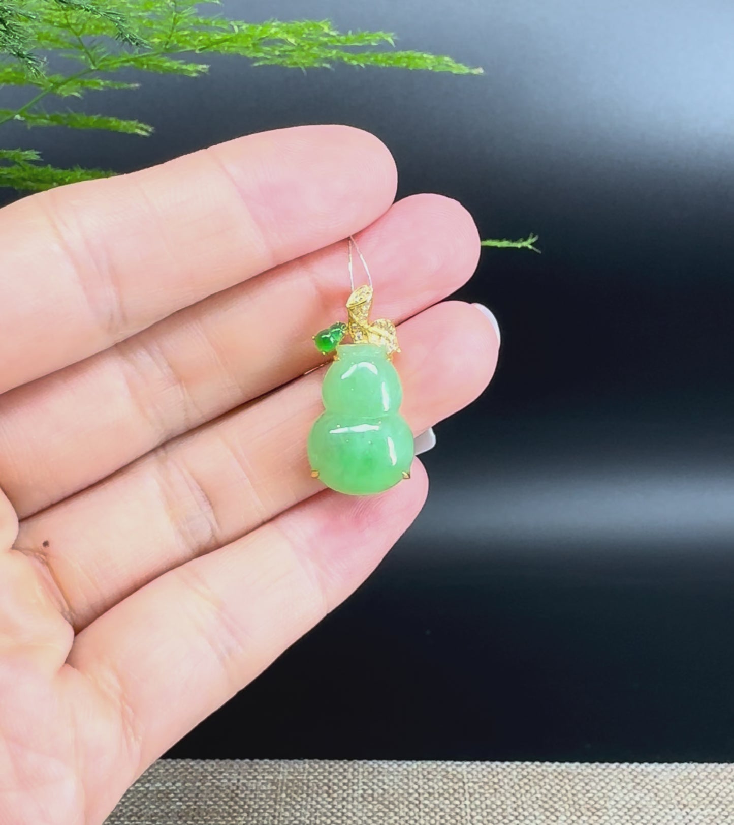 Load and play video in Gallery viewer, RealJade® Co. Genuine Green Jadeite Jade Good Luck Hulu Bottle Gourd Necklace With 18K Yellow Gold Bail
