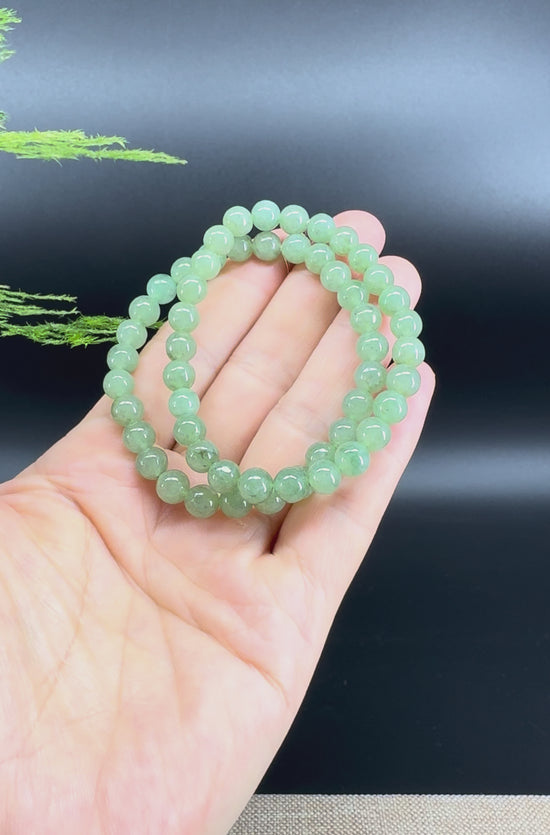 Load and play video in Gallery viewer, Natural Jadeite Jade  Round light Green Beads Bracelet ( 6.5mm )
